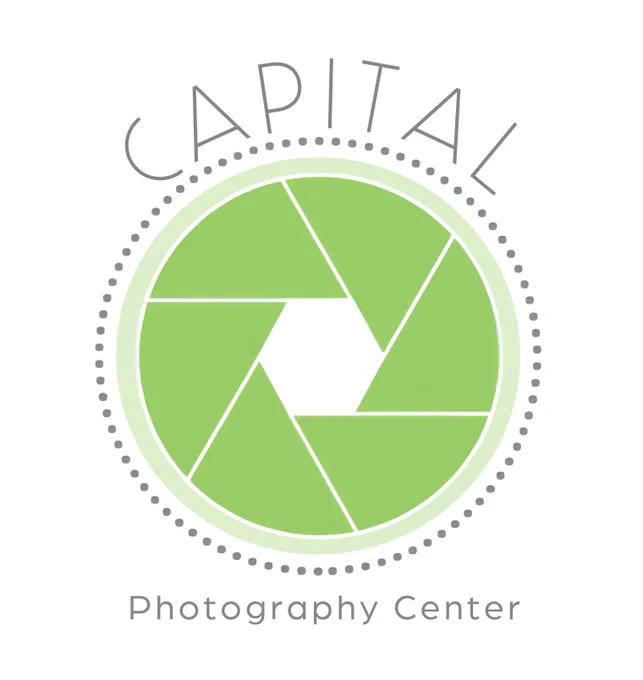 Capital Photography Center logo with green aperture in center