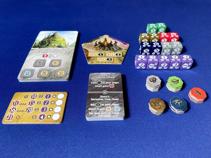 Different components from the Rise of Titans expansion for the board game Shadow Kingdoms of Valeria. The components include dice, tokens, tiles and cards.