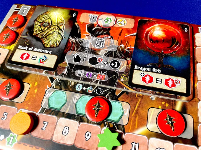 A closeup shot of a player board of the Orc warden from Shadow Kingdoms of Valeria. The board has a new tile from the Riftlands expansion and two relic cards atop it.