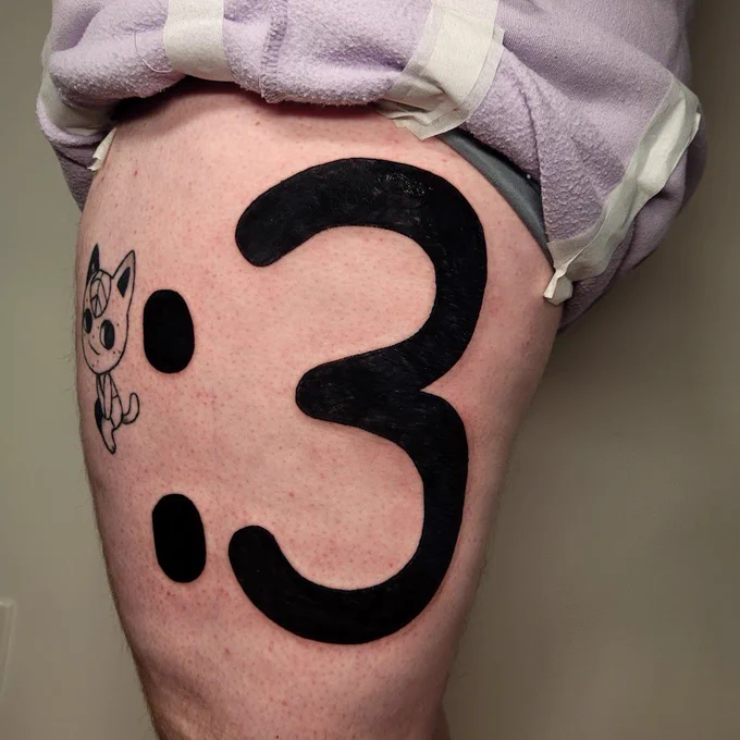massive :3 tattoo in comic sans on someone's thigh by spoopy