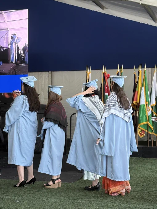 columbia students wearing keffiyehs at the school of social work