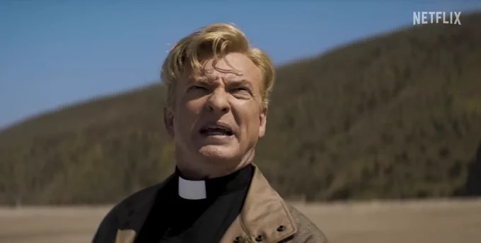Rhys Darby in Love, Death & Robots  as a priest staring up at an alien on a beach
