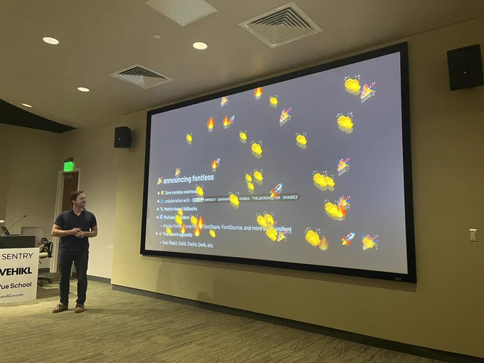 Photo of the VueConf US 2025 stage during Daniel Roe's talk on the State of Nuxt 2025 where he announces fontless - a Vite plugin to apply "Magical plug-and-play font optimization for modern web applications"