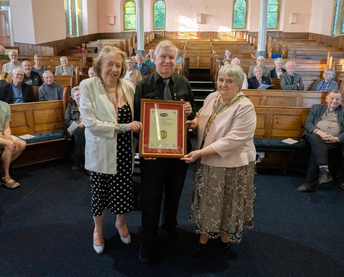 Outgoing Chair Joan Nicholson (right) presents David Heatherington with his Chairman’s Medal (centre), alongside Philippa Rowe, Chair of the Weardale Museum (left).