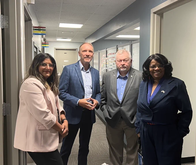 A photo shows Oakland County Executive Dave Coulter with MI Rep. Brenda Carter and MI Rep. Greg Markkanen.