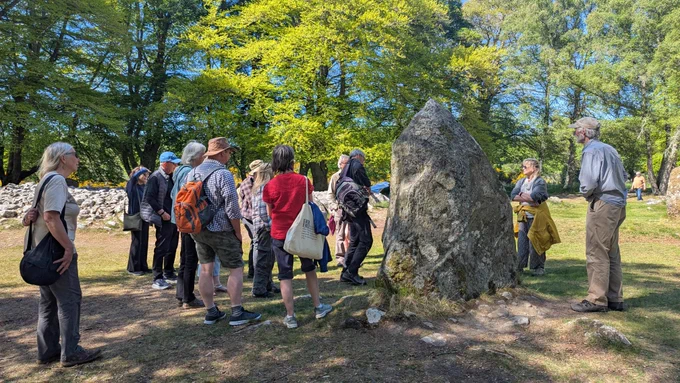 Participants of the Culloden Rock Art workshop exploring the rock art found at the Clava Cairns © ScARF