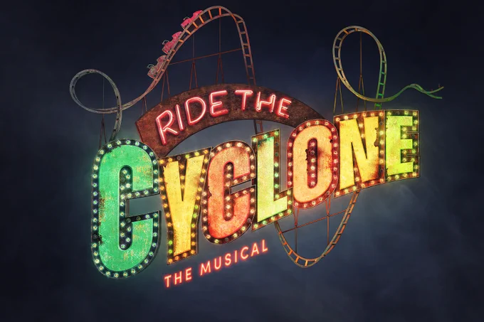 A photo showing the words "Ride the Cyclone the Musical" in glowing bulb lighting surrounded by a rickety rollercoaster 