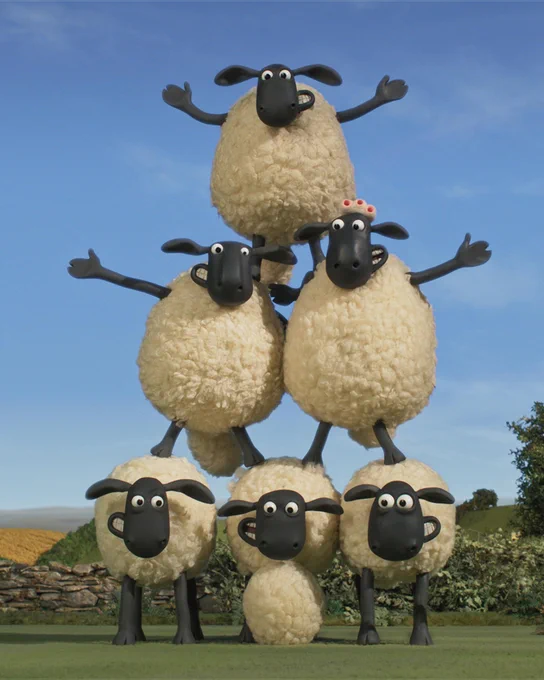 A playful image of a stack of Shaun the Sheep characters, set against a scenic backdrop of green hills and blue sky.