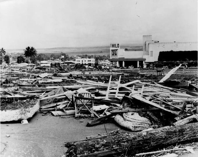  Black and white photo of the total destruction of a building in Hilo, Hawaii after the 1965 Chilean Tsunami
Credit: Pacific Tide Party; NOAA
