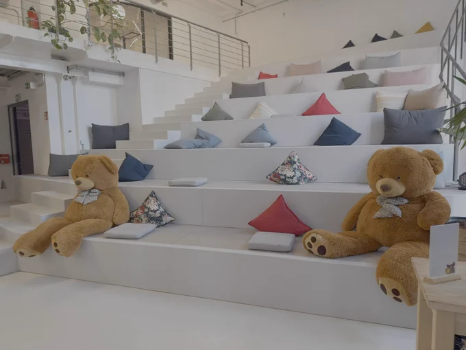 Two teddy bears on attendee seats