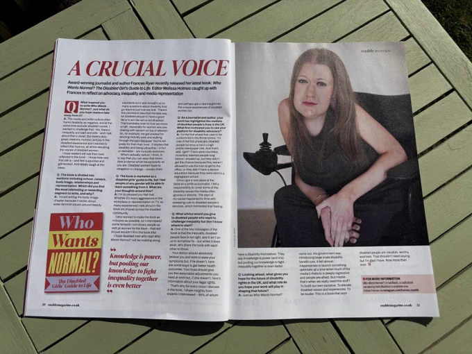 A double page spread of my interview for Enable magazine. On the left side is text and an image of my book, Who Wants Normal? On the right hand page is a large photo of me and some text. The magazine is placed on a green garden table.