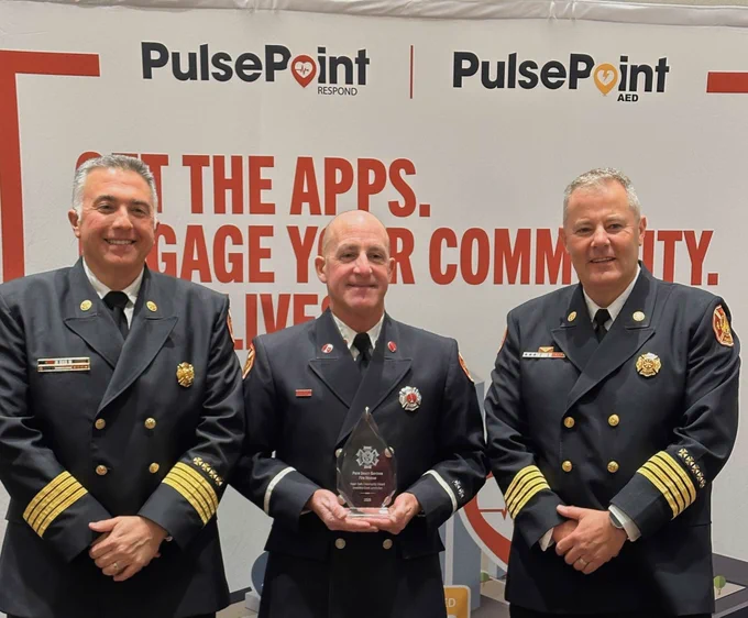 Palm Beach Gardens Fire Rescue Chiefs James Ippolito and Alex Lamb and Rescue Lieutenant Michael Ventura accept the Heart Safe Community Award.