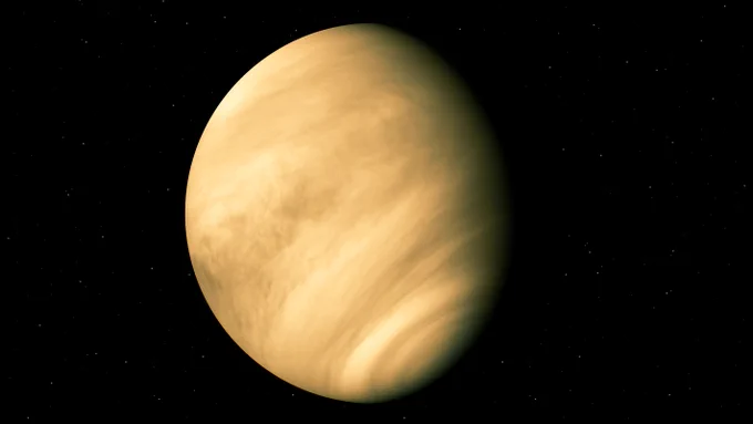 An illustration of a tan, hazy planet set on a black background. 
