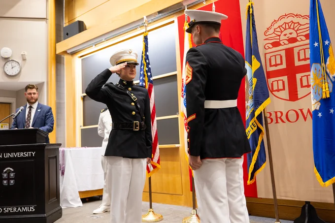 Brown graduate Juliette Hopgood receives her first salute as a second lieutenant in the U.S. Marine Corps.