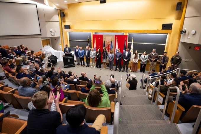 Graduating veterans receive a round of applause from the crowd.