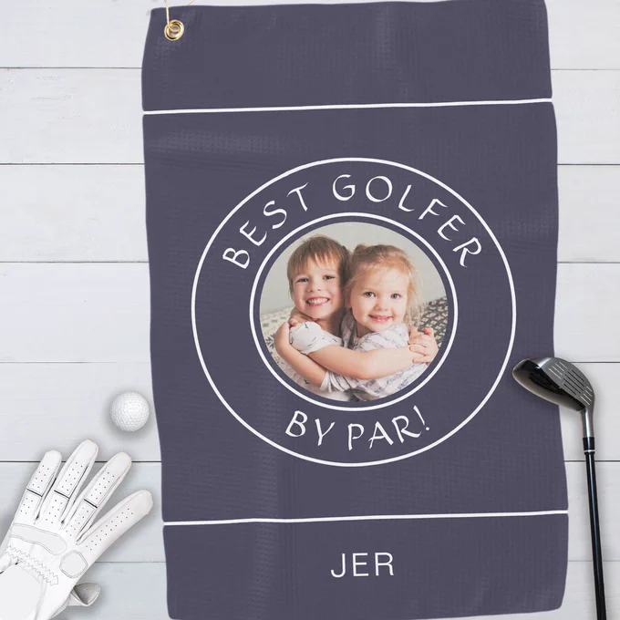 Dark blue golf towel featuring a customizable family photo and personalized text in white with circular borders. A fun and meaningful gift for golf lovers. All colors in this design may be customized.