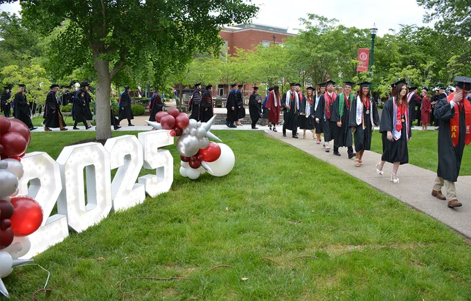 graduating seniors walking for commencement