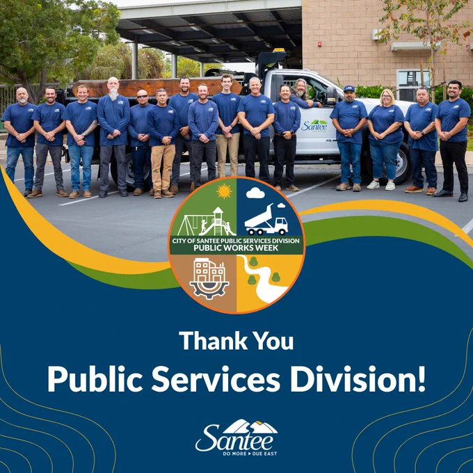 Group of Public Services Division employees in uniforms standing outdoors, celebrating Public Works Week with a banner that reads "Thank You Public Services Division!" in the City of Santee.