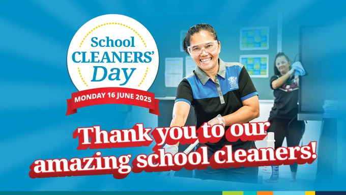 Smiling woman wearing protective eyewear and gloves holds cleaning equipment. Two others clean a learning space. School Cleaners’ Day, 16 June 2025 branding with blue background. 
