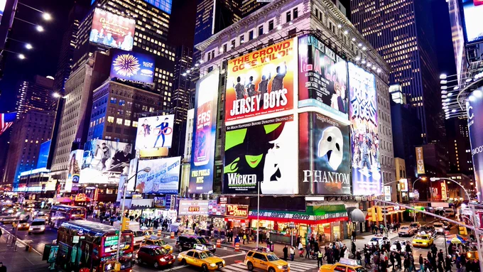Broadway in New York City lights up at night. Photo by Andrey Bayda/Shutterstock