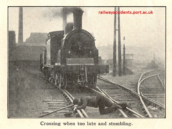 Posed 1920s safety photo showing a worker having stumbled and fallen in front of a train, as he tried to cross the line.