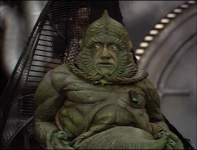 Sil sitting in his chair, wishing they had found a more attractive new body for Lord Kiv.
