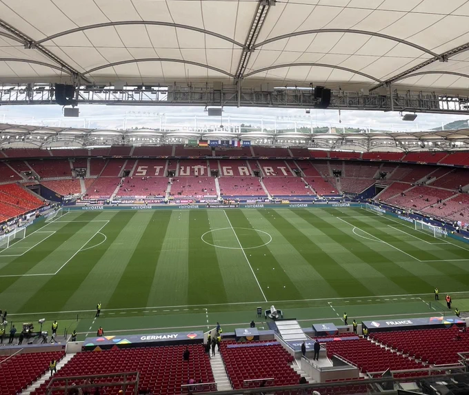 View from the media tribune. In the upper tier of the stadium on the halfway line.