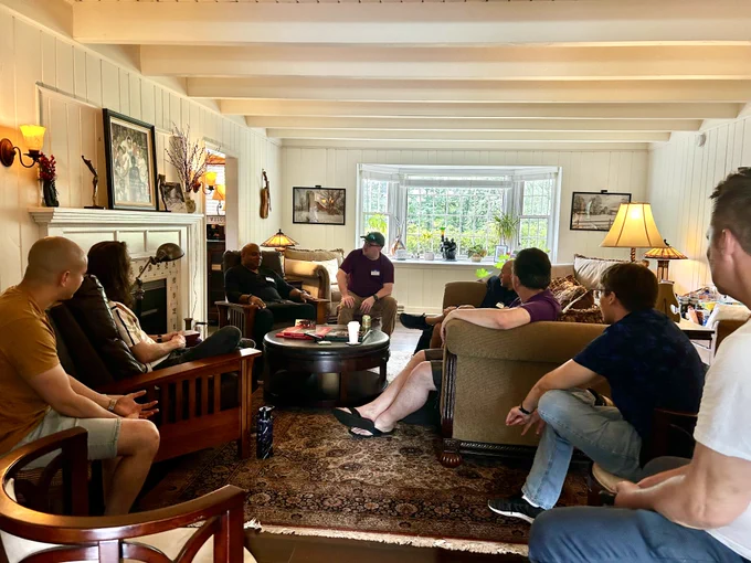 NJTC members sitting in a cozy living room, chatting about tech