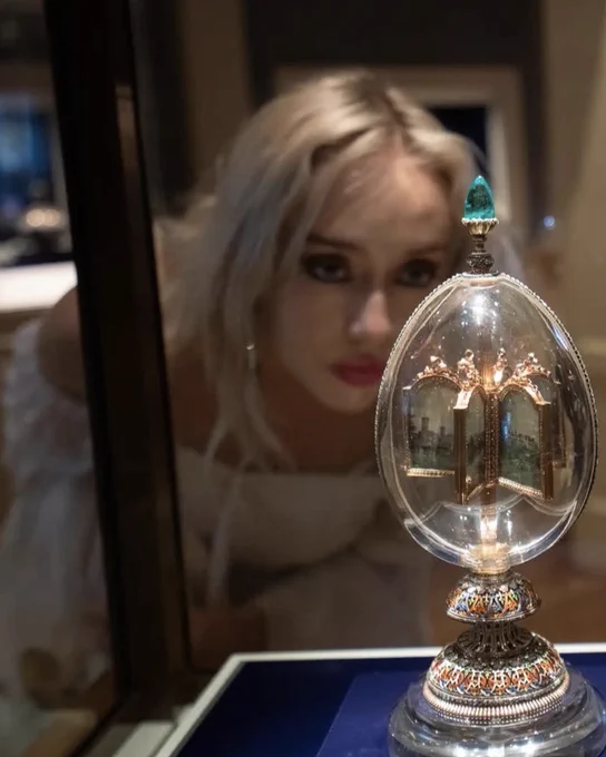 A museum visitor takes a close look at a Fabergé egg on display at the Virginia Museum of Fine Arts.