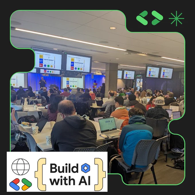 Many people sit at long tables working on laptops while a person presents on stage in front of a projector screen. The logo "Build with AI" is in the bottom left corner. 