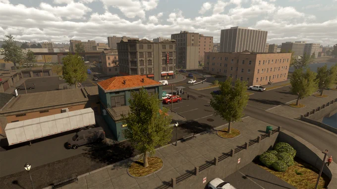 A screenshot from the game Flashing Lights showing a city environment. Buildings, roads, trees and cars can be seen.