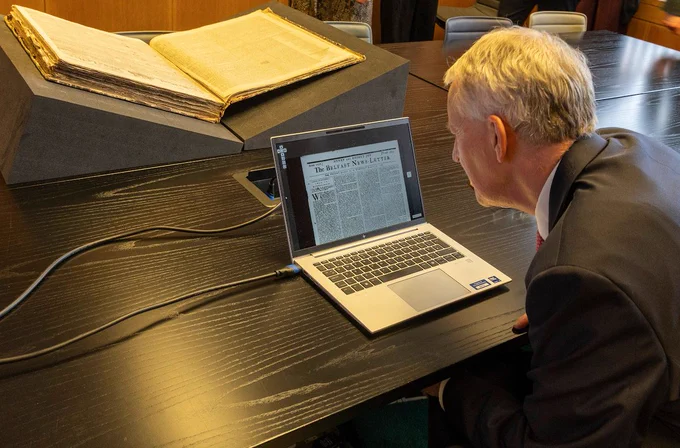 Secretary of State Hilary Benn views newly digitised historic editions of the News Letter during a visit to the British Library in London.
