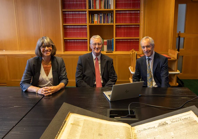 Secretary of State Hilary Benn views newly digitised historic editions of the News Letter during a visit to the British Library in London, accompanied by British Library Chief Executive Rebecca Lawrence and Richard Hall, DC Thomson Deputy Chair.