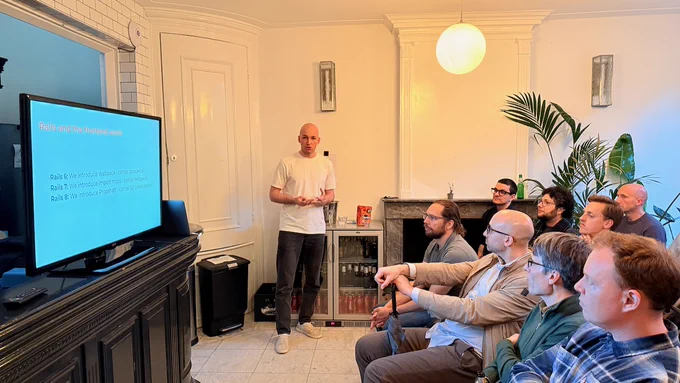 Roman Samoilov giving a presentation in front of a crowd.
