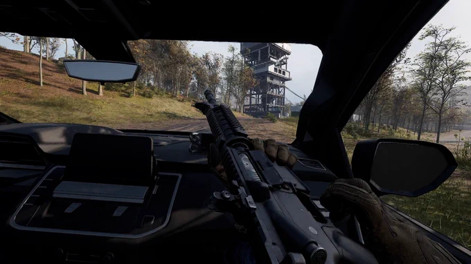 In-Game screenshot of WARDOGS. Weapon Inspect in transport vehicle. Approaching tower.