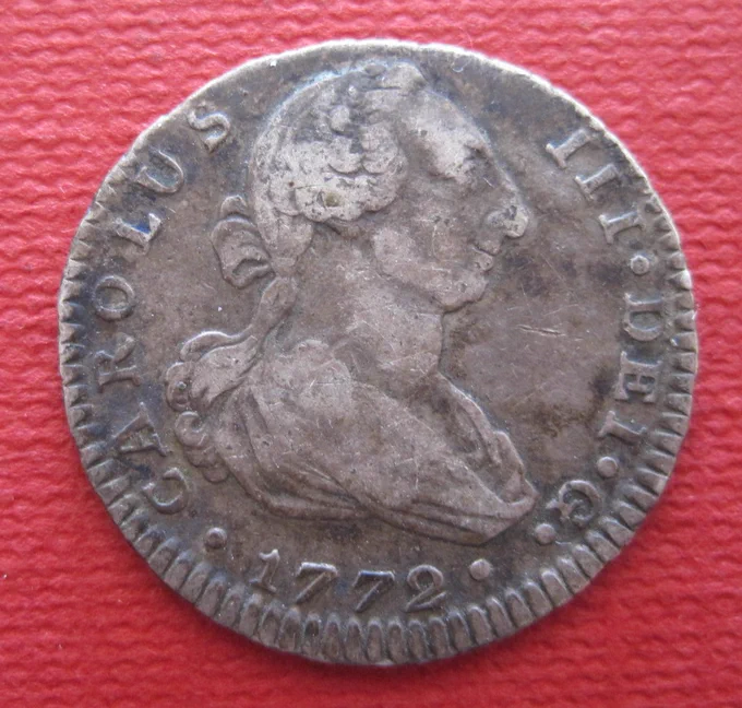 Real acuñado bajo la nueva Real Pragmática de 1772 con el busto de Carlos III.
Masa: 2,78g.
Diámetro: 20,5mm. 