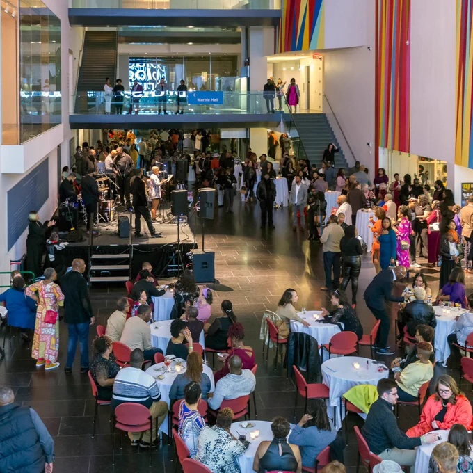 A wide shot of a large crowd in VMFA's Cochrane Atrium during an Art After Hours event.