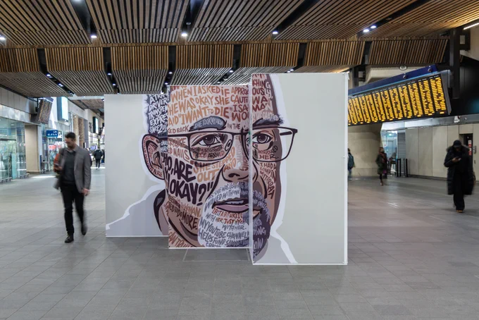 Samaritans' Power of Words exhibition, featuring Don. The portrait is made up of words, and his story of how he saved someone's life using small talk.