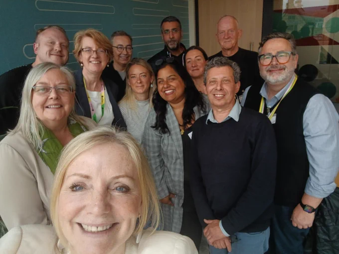 Selfie photograph of the Mayor of West Yorkshire with eleven people. They are stood, all smiling towards the camera.