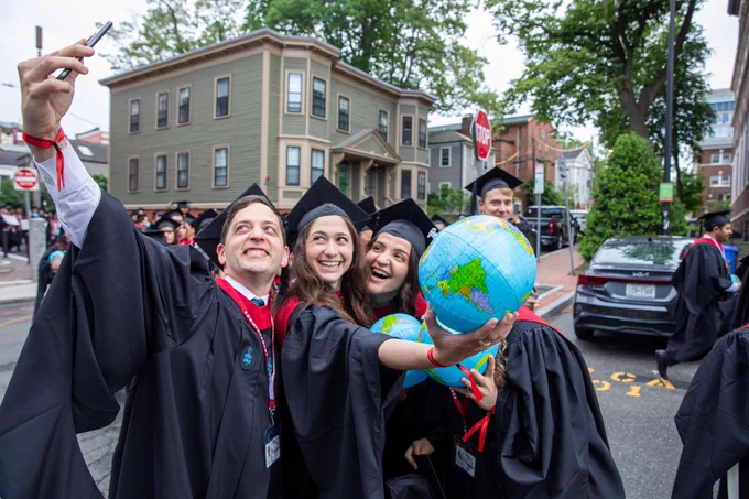 Graduates posing for a selfie.