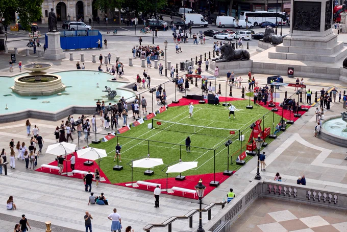 Photo of people playing at the pop up HSBC Championships tennis court in Trafalgar Square