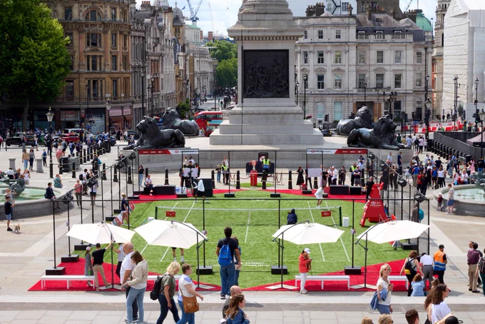 Photo of people playing at the pop up HSBC Championships tennis court in Trafalgar Square