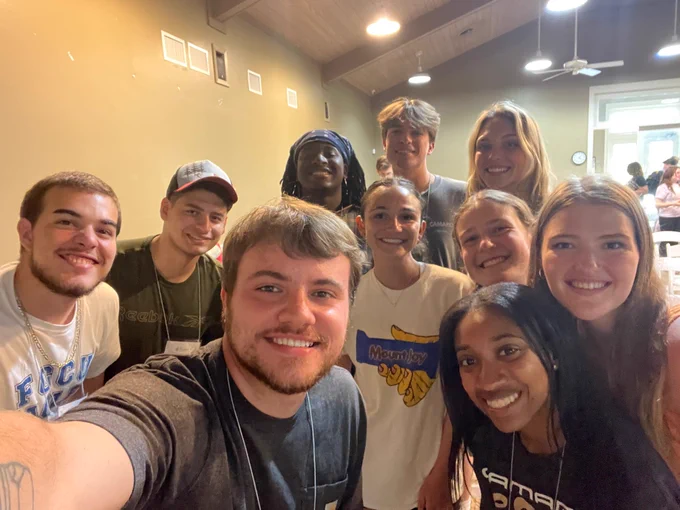 a group of students take a photo 