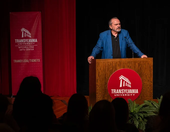 person giving a lecture on stage