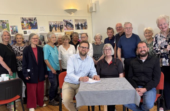 Photo shows Horspath Villagers at the Horspath Hub supporting the signing of a petition to re-open the post office
From row left to right Freddie van Mierlo MP, Judy Kent former Outreach sub-postmistress and Cllr Tim Bearder 
ENDS