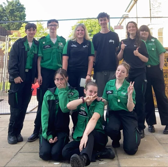 9 St John Ambulance cadets, celebrating their success at becoming future lifesavers