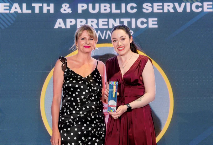 Stacey Mullee collecting her award for Health and Public Service Apprentice of the Year