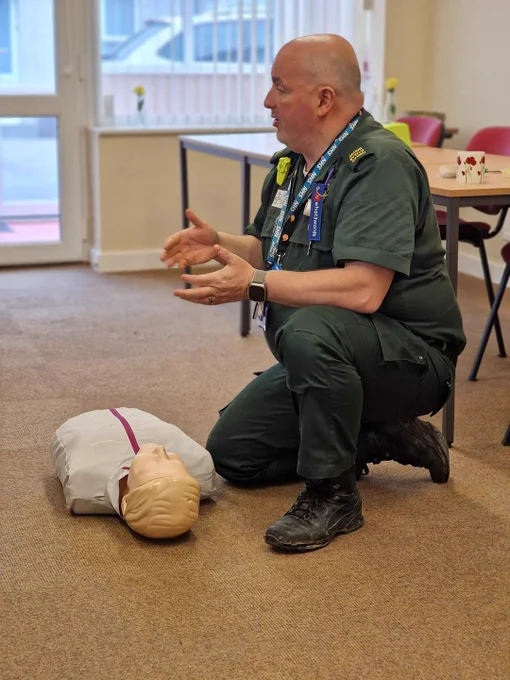 Tomos  at work sharing his knowledge of CPR and defibrillators.