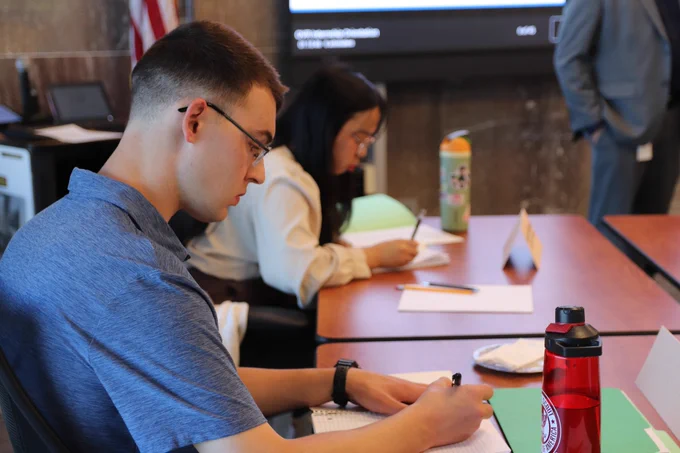 The Shapiro Administration welcomed 10 Pennsylvania college students with disabilities to the 2025 Office of Vocational Rehabilitation (OVR) summer internship program. Photo of interns taking notes during orientation.