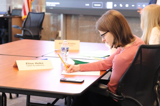 The Shapiro Administration welcomed 10 Pennsylvania college students with disabilities to the 2025 Office of Vocational Rehabilitation (OVR) summer internship program. Photo of an intern taking notes during orientation.